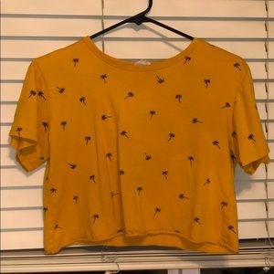 Yellow crop top with black palm trees